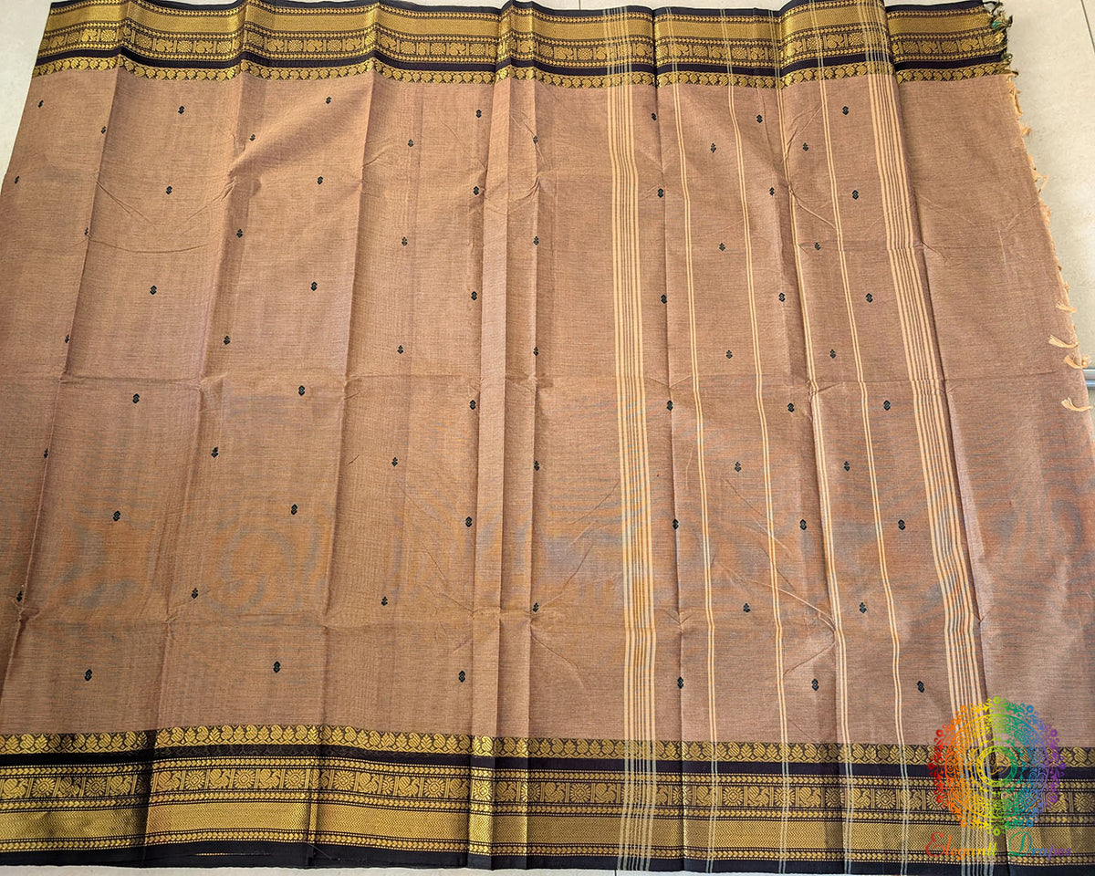 Full brown Kanchi cotton saree laid flat showing complete design and drape