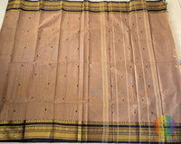 Full brown Kanchi cotton saree laid flat showing complete design and drape
