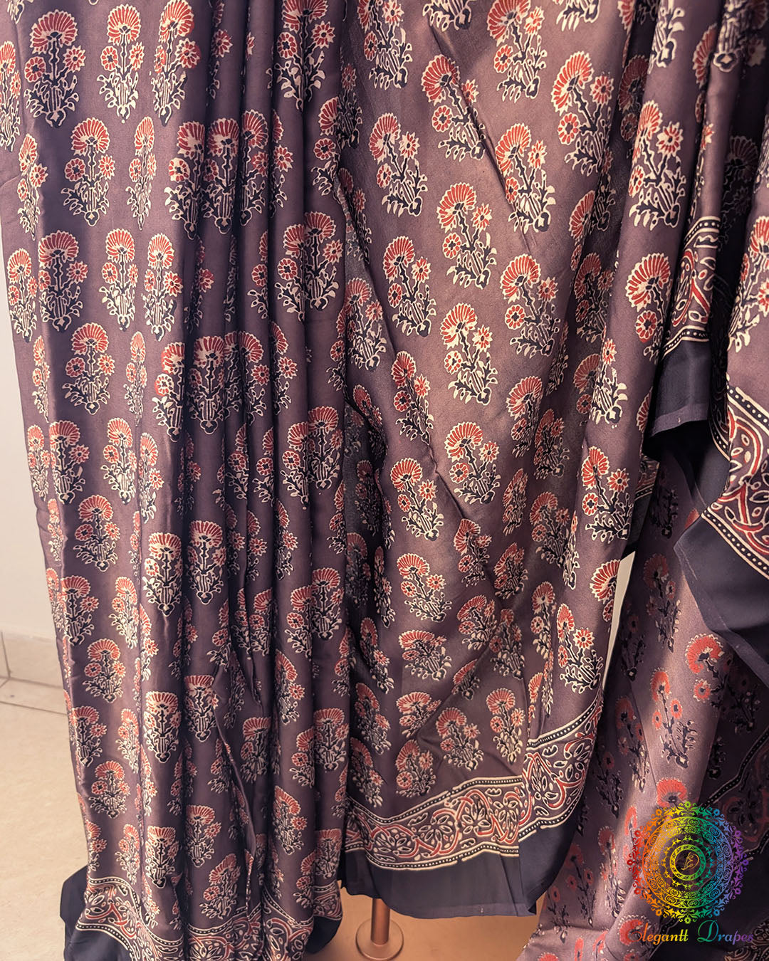 Close up of brown modal silk Ajrakh block print saree
