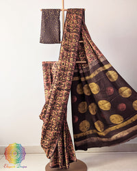 Brown Nashpal Pomegranate Ajrakh Modal Tussar Saree with the palla neatly pleated, highlighting the layered design and intricate traditional Ajrakh print.