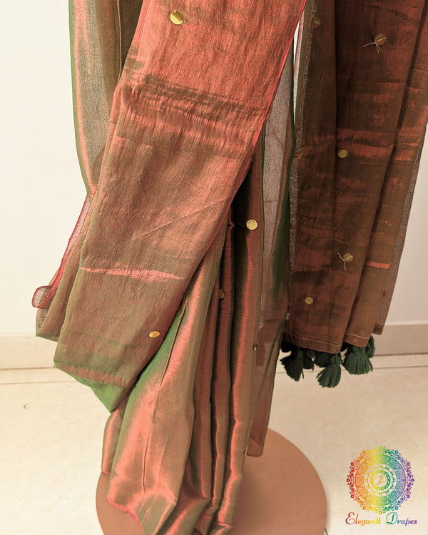 Detailed view of subtle sequins embellishment on brown tissue saree