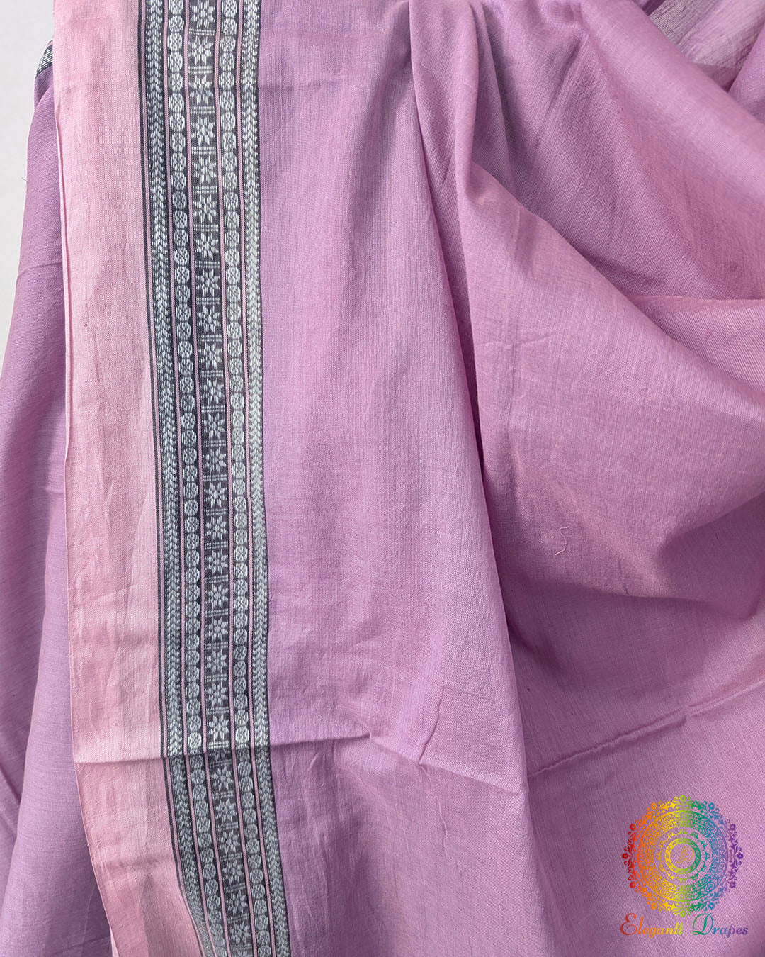 Close up of lavender pink bengal cotton saree showing soft cotton weave