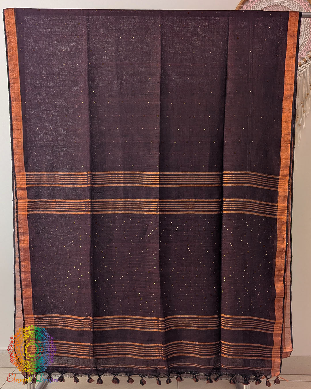 Full coffee brown linen saree laid open showing overall design and layout