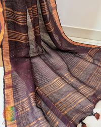 Sequin detail close up on coffee brown linen saree highlighting subtle shine