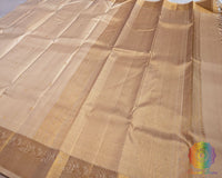 Cream Kanjivaram silk saree pallu view with zari checks