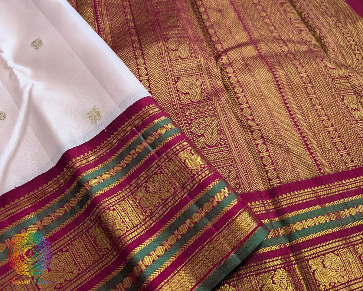 Close up of off white Kanjivaram silk saree showing pure silk weave and zari detail