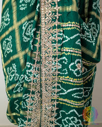 Detailed border featuring Gota Patti handwork on the Deep Green Gaji Silk Gharchola Saree