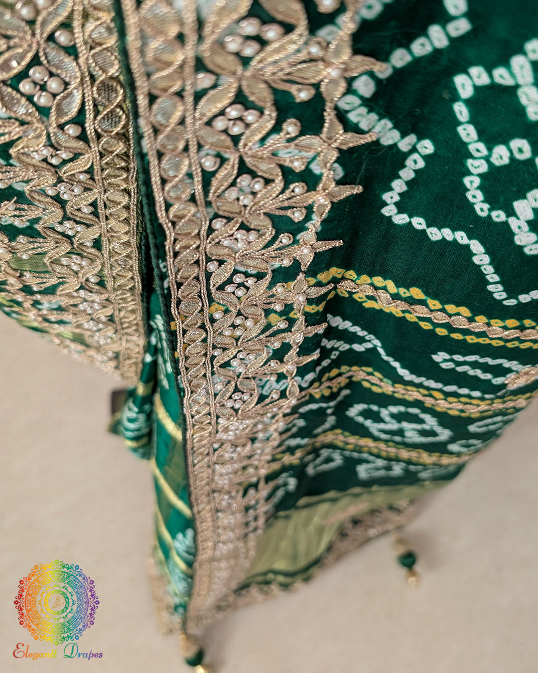 Close-up of intricate Gota Patti handwork on the pallu of the Deep Green Gharchola Saree