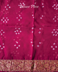Matching blouse piece with coordinated Banarasi weaving and Bandhani design