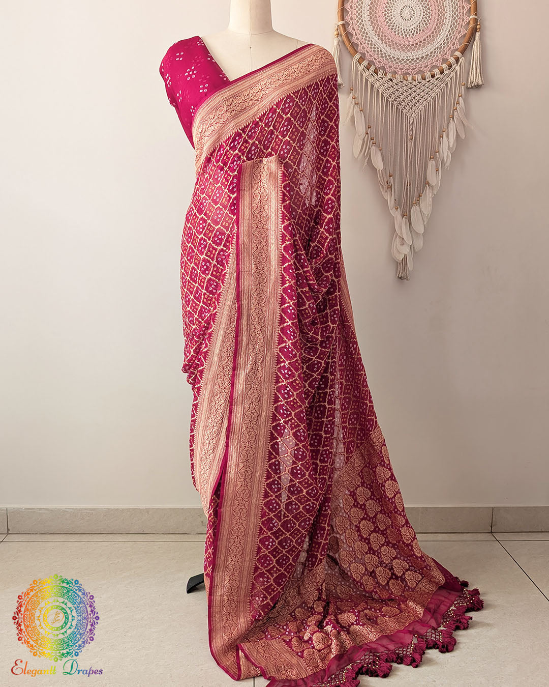 Deep magenta Khaddi georgette Banarasi Bandhani saree highlighting the Banarasi woven palla and heavy handcrafted tassels