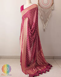 Side view of deep magenta Khaddi georgette Banarasi Bandhani saree showcasing elegant drape