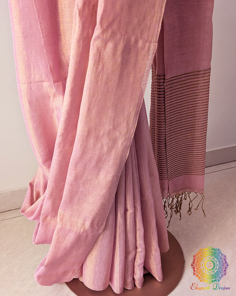 Palla close up on blush pink Bengal linen tissue saree highlighting woven texture