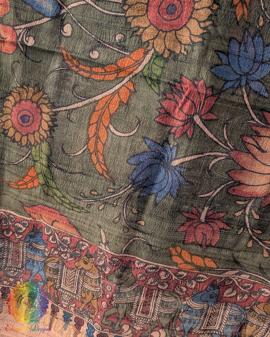 Close-up of authentic hand-painted Kalamkari artwork highlighting the rich texture and natural sheen of Forest Green Pure Tussar Silk dupatta