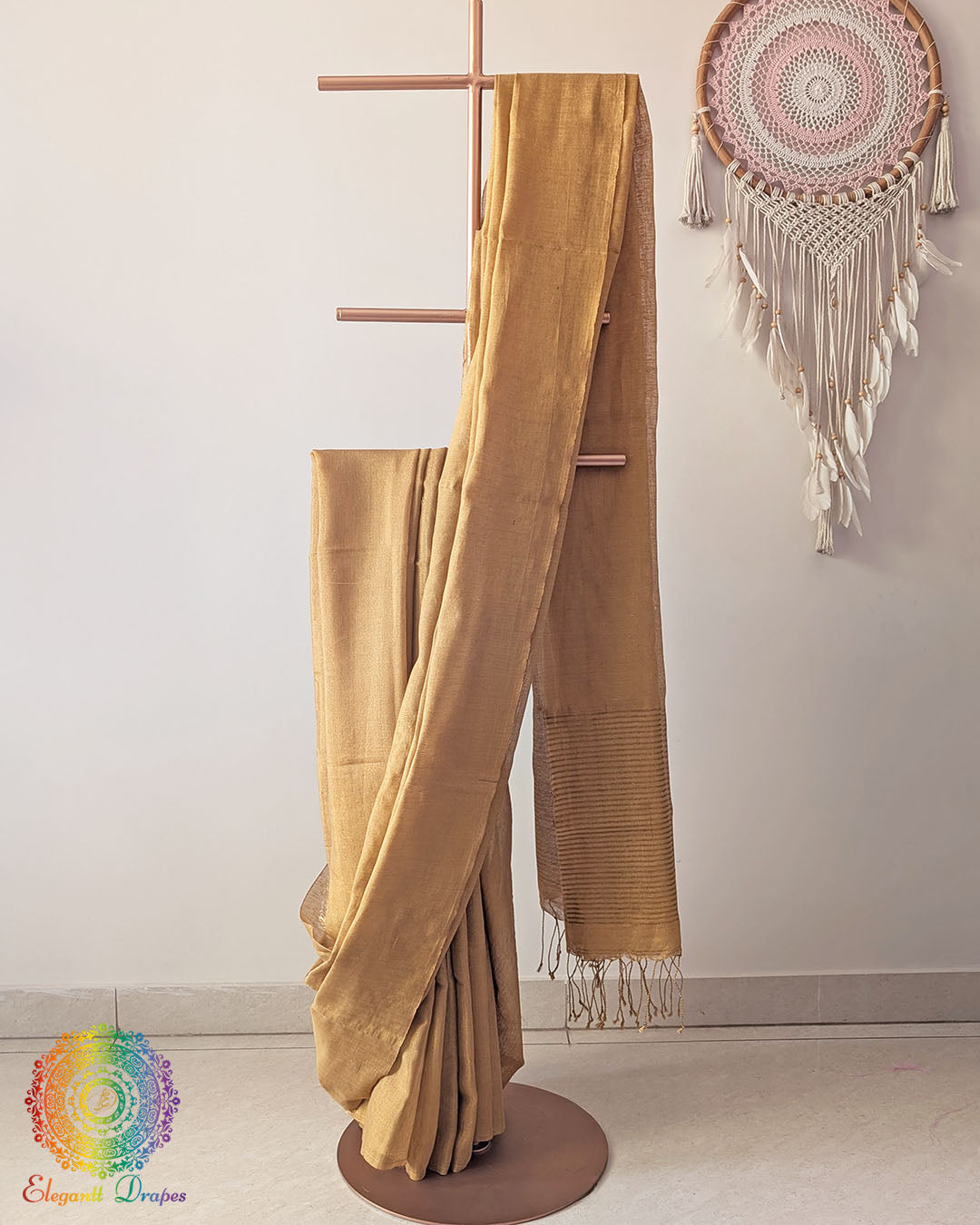 Golden Bengal linen tissue saree showing elegant drape and luminous texture