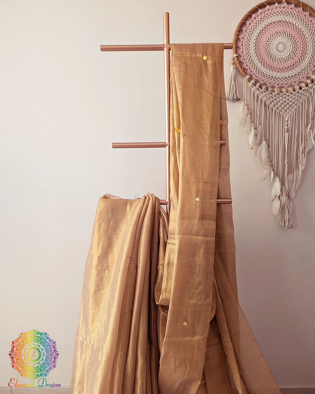 Close up of golden Bengal mul tissue saree with sequins work