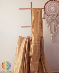 Close up of golden Bengal mul tissue saree with sequins work