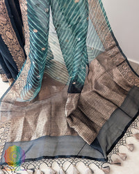 Close-up of Kadhuwa Banarasi Weave and Zari Detailing on Green Kora Silk Saree