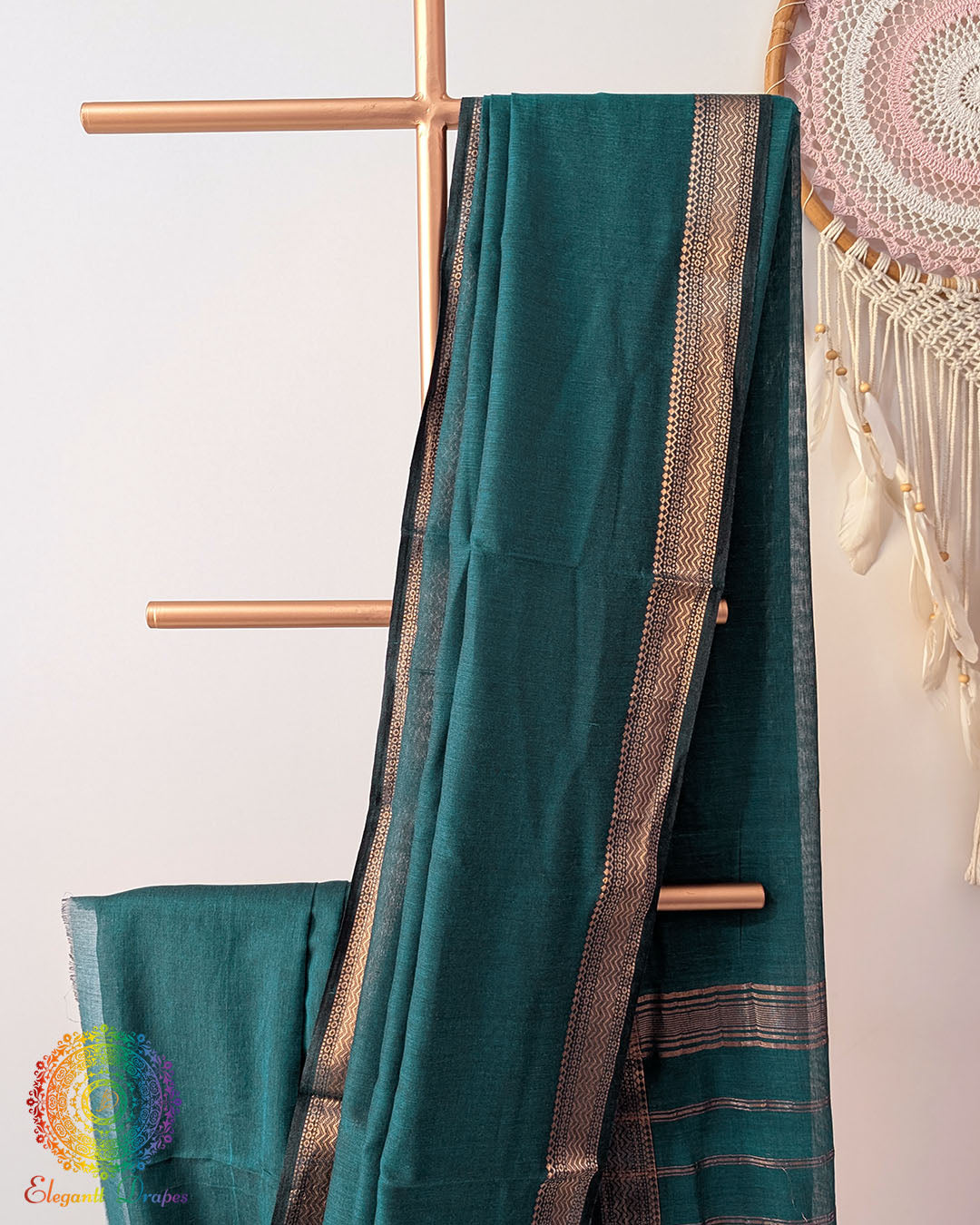 Green Bengal cotton saree body close up highlighting fabric texture and border