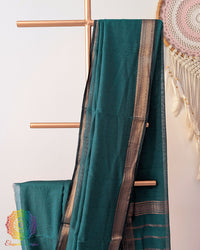 Green Bengal cotton saree body close up highlighting fabric texture and border