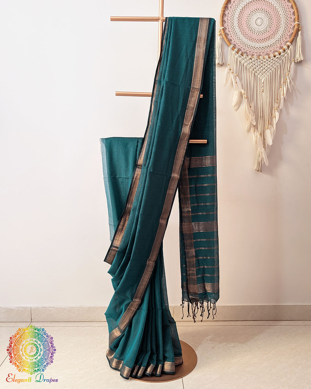 Green Bengal cotton saree with zari border on mannequin showing full drape