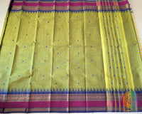 Full green Kanchi cotton saree laid flat showing contrast border and overall design