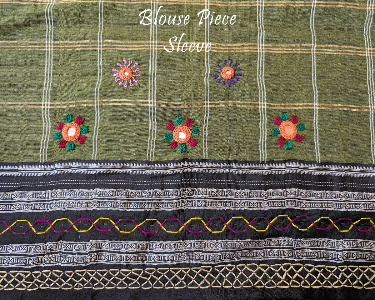 Matching blouse sleeve featuring intricate handcrafted Lambani embroidery that highlights the fine artisan craftsmanship and coordinated design of the saree ensemble.