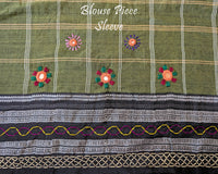 Matching blouse sleeve featuring intricate handcrafted Lambani embroidery that highlights the fine artisan craftsmanship and coordinated design of the saree ensemble.
