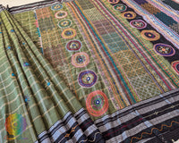 Close-up of diagonal Lambani embroidered bels and floral bootas on the Green Ilkal cotton saree