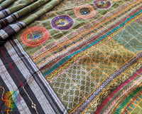 Close-up of intricate multicolored Lambani hand embroidery on the richly embellished palla