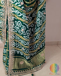 Close-up of intricate Gota Patti handwork on the pallu of the Emerald Green Gharchola Saree