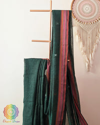 Green linen saree body close up highlighting Bhujodi weave texture