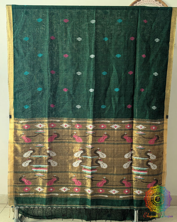 Full green linen saree laid open showing overall design and layout