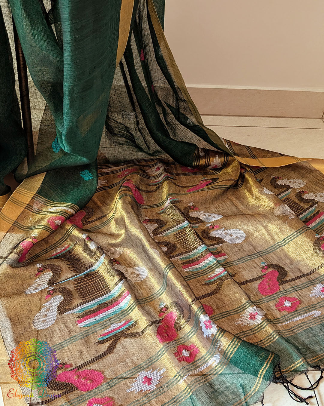 Paithani palla close up on green linen saree highlighting detailed motifs