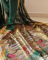 Paithani palla close up on green linen saree highlighting detailed motifs