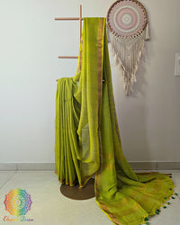 Green linen saree with sequins on mannequin showing complete drape
