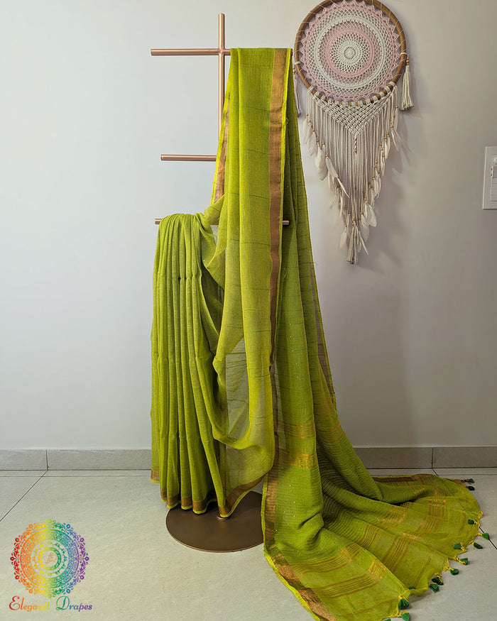 Green linen saree with sequins on mannequin showing complete drape