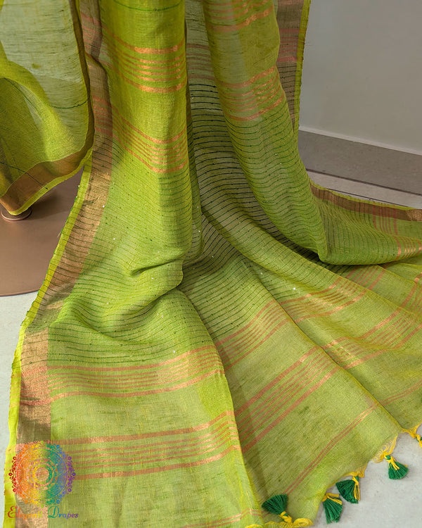 Sequin detail close up on green linen saree highlighting subtle shimmer