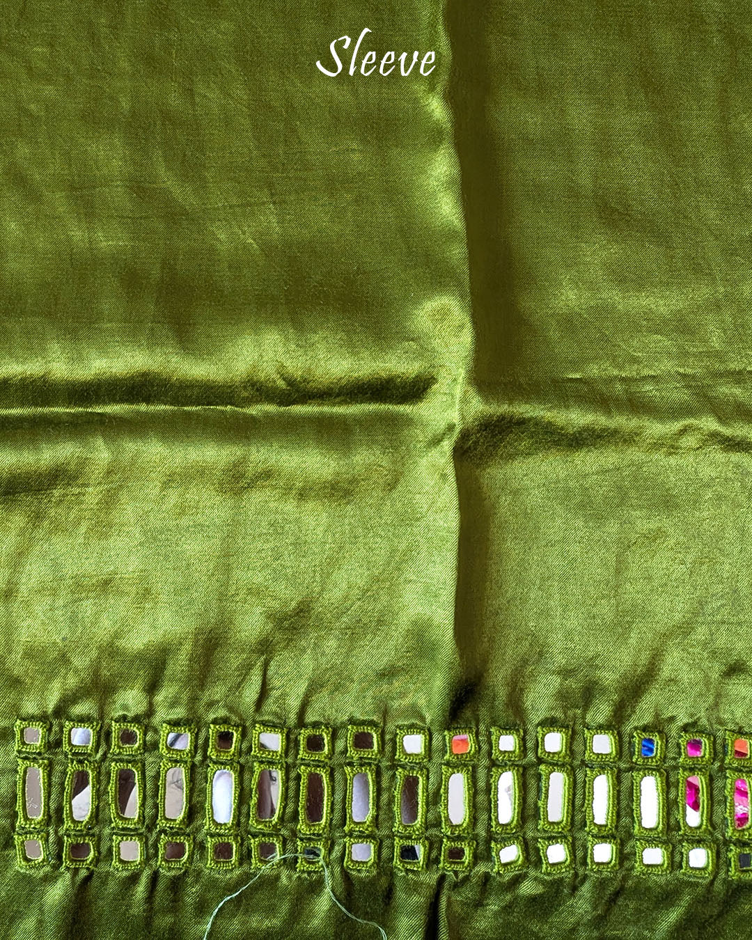 Close-up of Kutch mirror embroidery on sleeve of Green Mashru Silk Blouse Piece