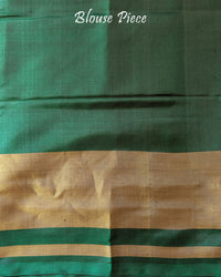 Green Handwoven Mulberry Silk Rajkot Patola Saree – Matching Blouse Piece View showcasing the accompanying blouse fabric coordinated with the saree's green colour and traditional Patola design.