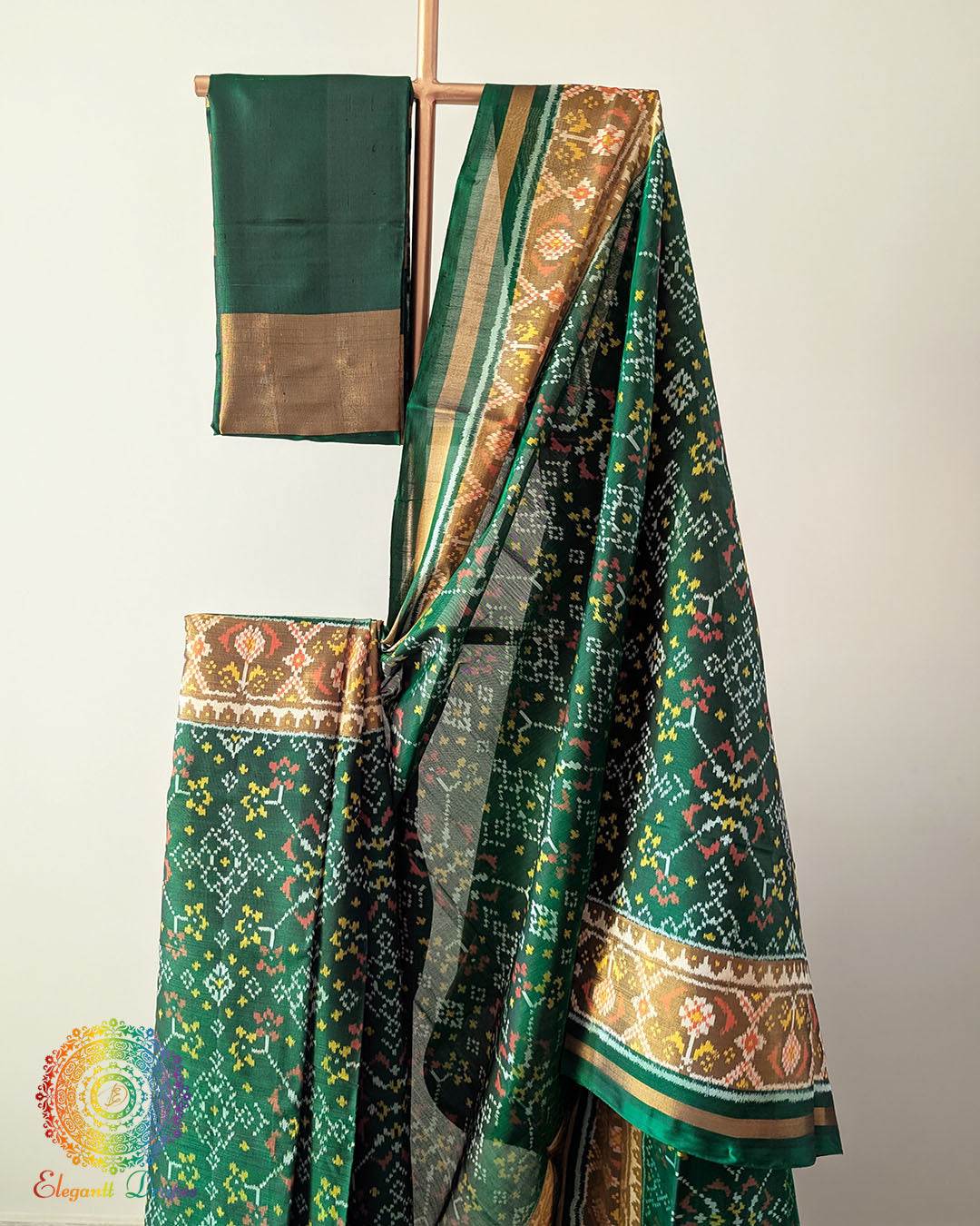 Green Handwoven Mulberry Silk Patola Saree – Body Pattern Close-Up showcasing the detailed motifs across the saree body, highlighting the traditional Rajkot Patola design and the rich green silk base.