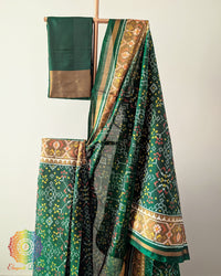 Green Handwoven Mulberry Silk Patola Saree – Body Pattern Close-Up showcasing the detailed motifs across the saree body, highlighting the traditional Rajkot Patola design and the rich green silk base.