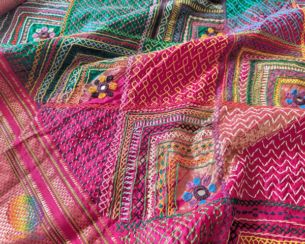 Emerald green Lambani embroidered Ilkal silk saree full layout view with pink accents