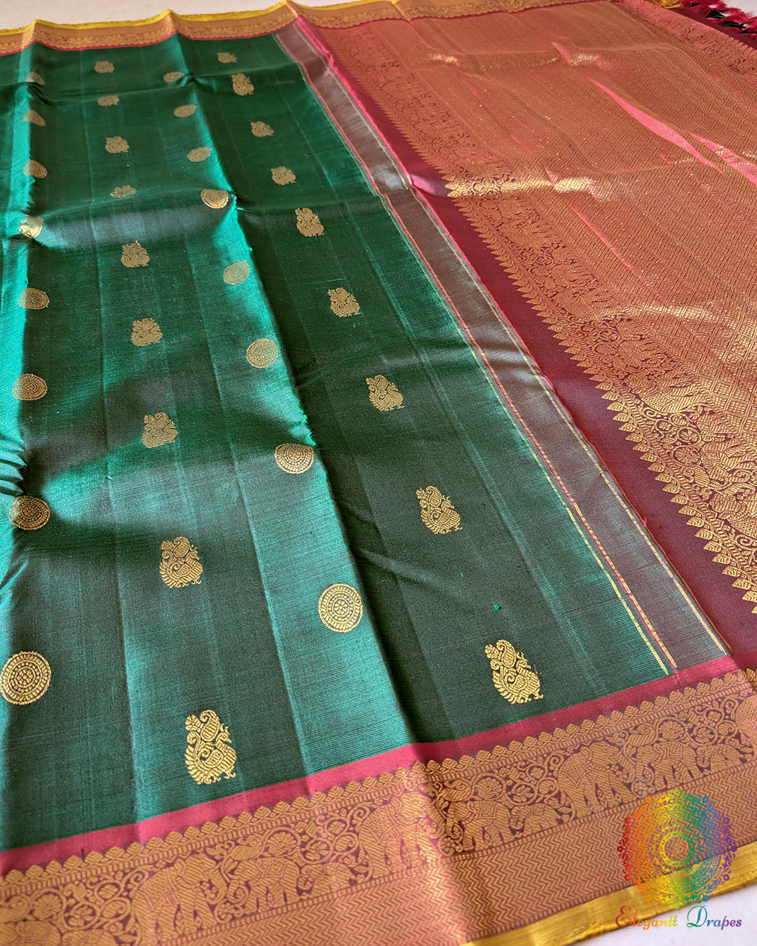 Green Kanjivaram silk saree body close up highlighting rich zari weaving