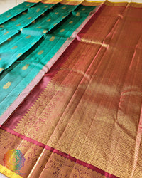 Red palla close up showcasing intricate 2 gram zari weaving on Kanjivaram silk saree