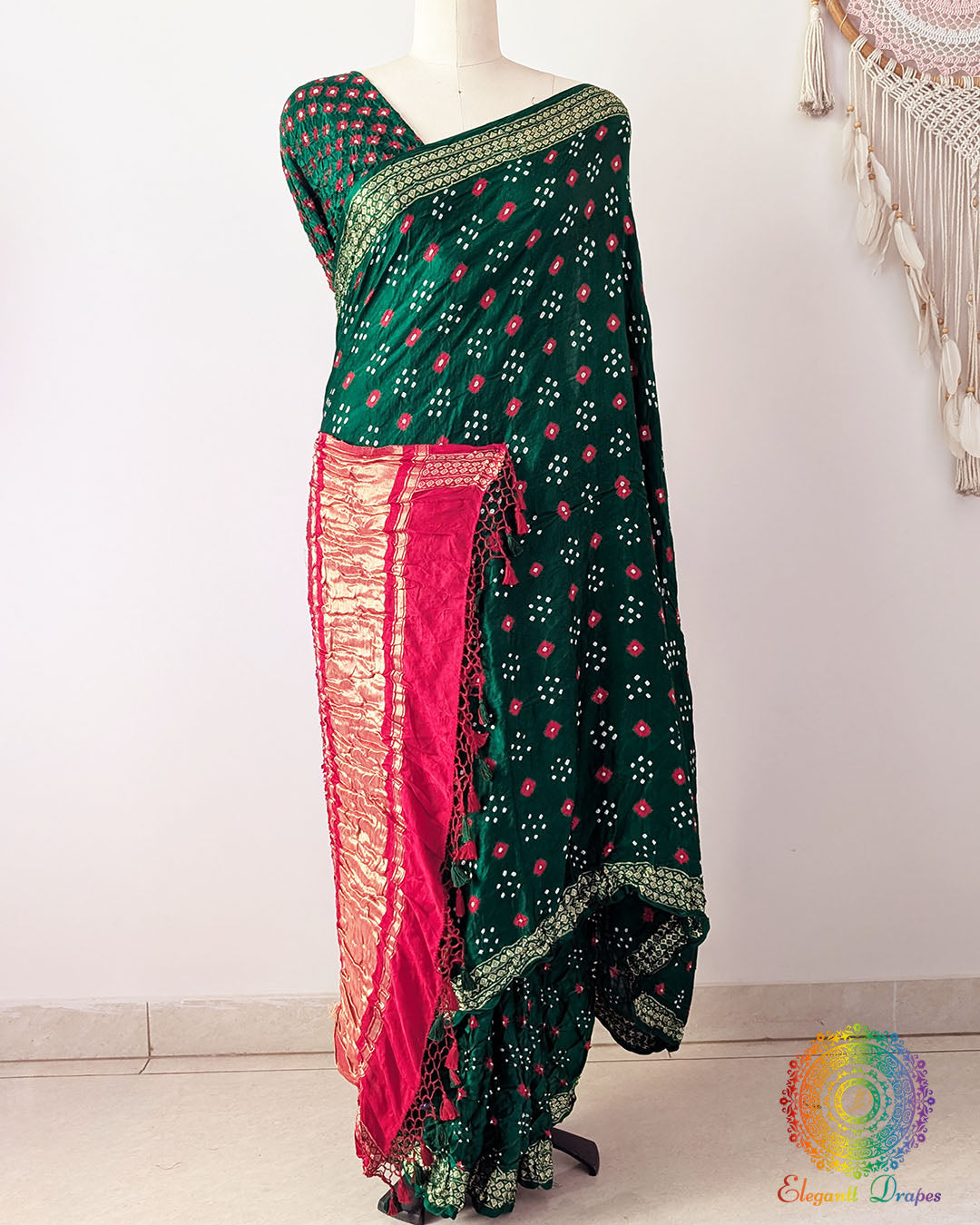 Green gaji silk Bandhani saree showcasing elegant drape and Nakshi border