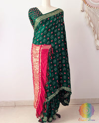 Green gaji silk Bandhani saree showcasing elegant drape and Nakshi border