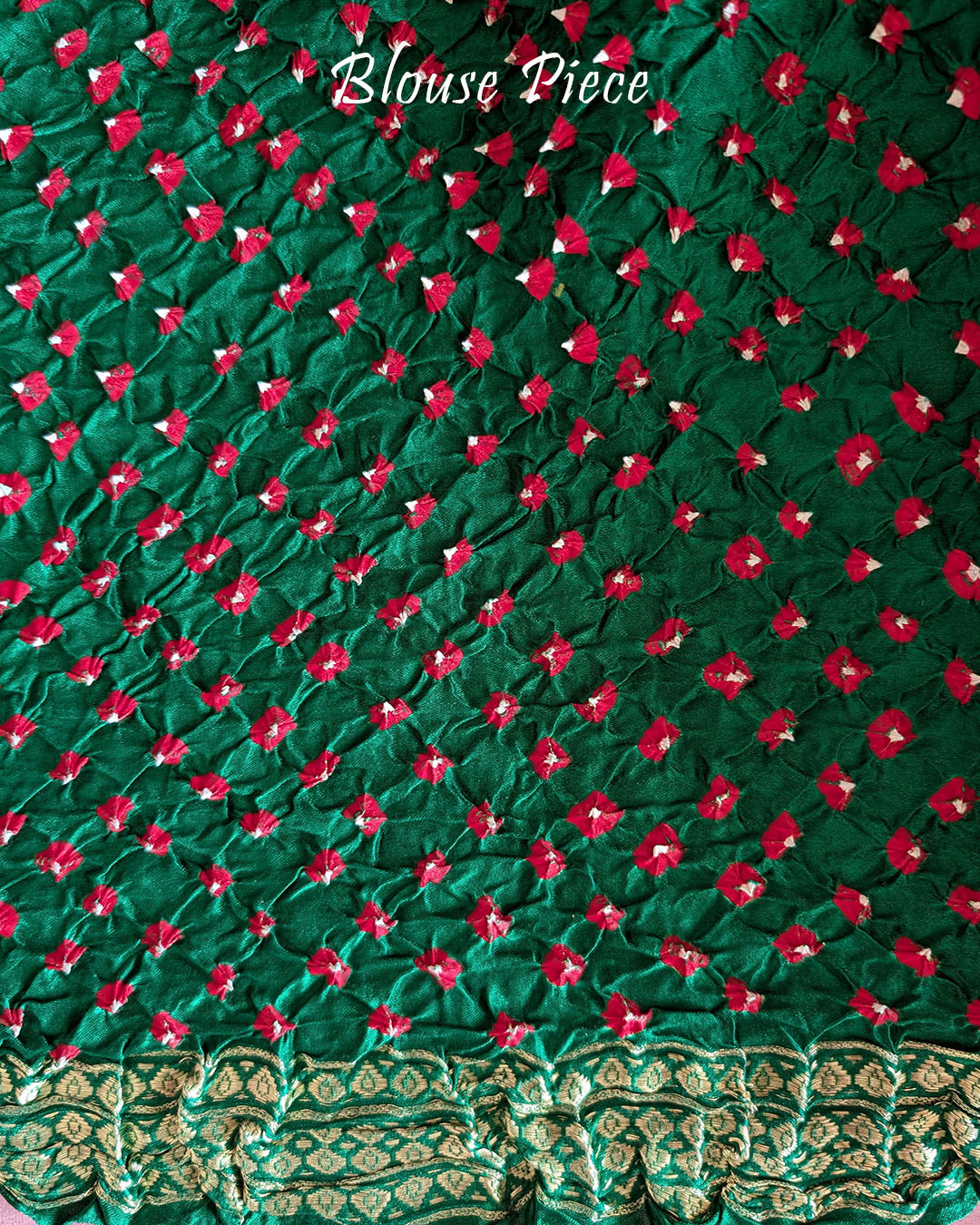 Matching green blouse piece with coordinated Nakshi border detailing