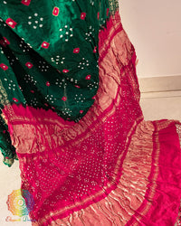 Close up of traditional Bandhani motifs on green pure gaji silk saree