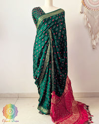 Green pure gaji silk Bandhani saree on mannequin with Nakshi woven border