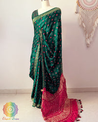 Green gaji silk saree palla highlighting Bandhani craftsmanship and Nakshi border